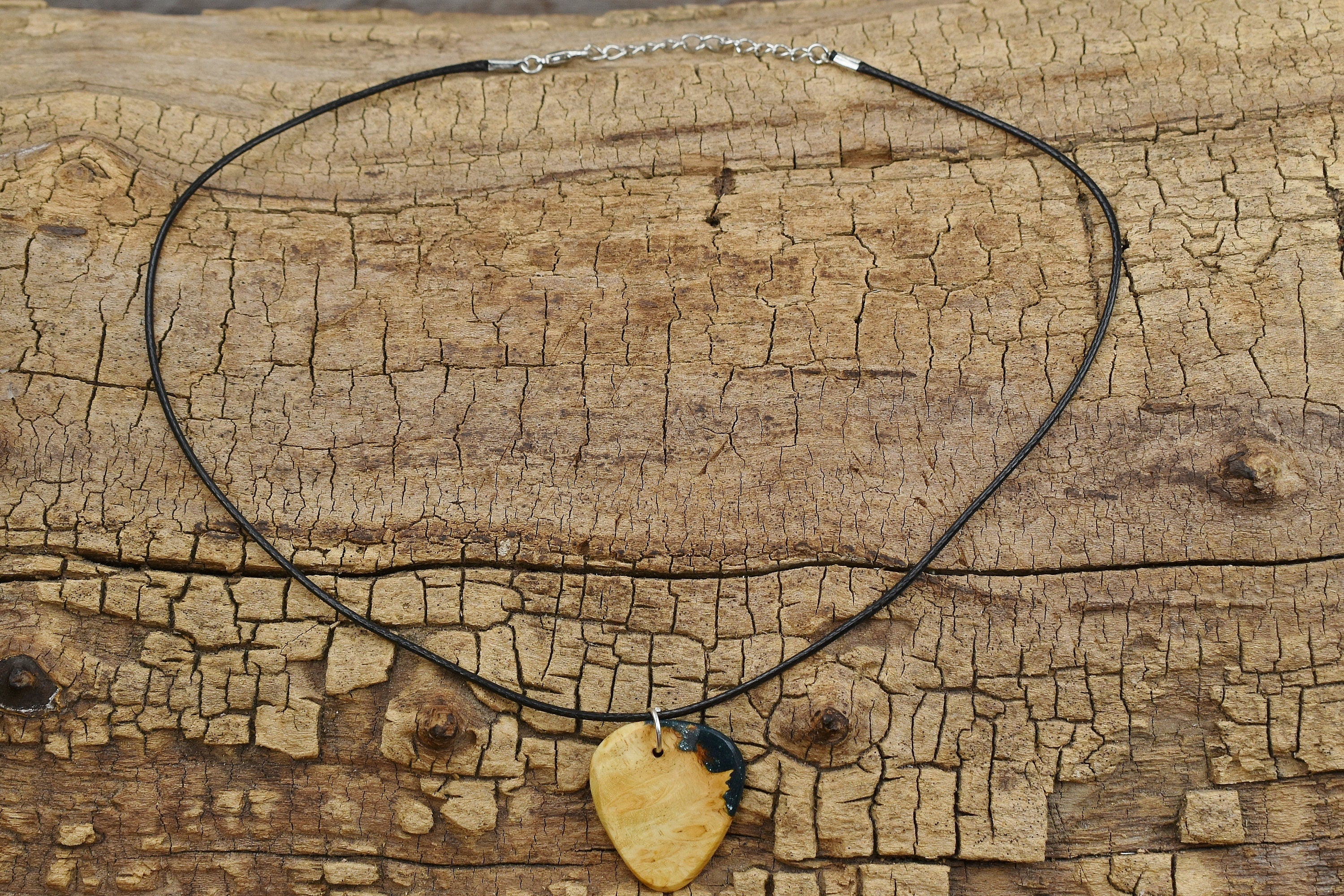 Handmade Afzelia Burl Guitar Pick Pendant: Emerald Green Resin Necklace