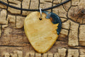 Handmade Afzelia Burl Guitar Pick Pendant: Emerald Green Resin Necklace
